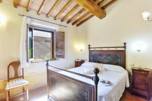 Postel nebo postele na pokoji v ubytování Agriturismo I Fuochi
