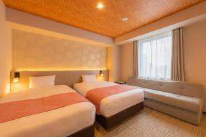Postel nebo postele na pokoji v ubytování Tosei Hotel Cocone Asakusa