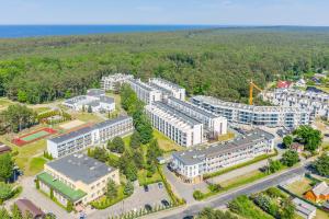 an aerial view of a building with a lot of buildings at Nadmorski apartament w lesie in Jantar