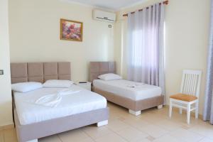 Voodi või voodid majutusasutuse Hotel Rixhi toas
