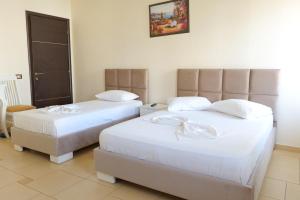Voodi või voodid majutusasutuse Hotel Rixhi toas