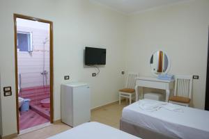 Voodi või voodid majutusasutuse Hotel Rixhi toas