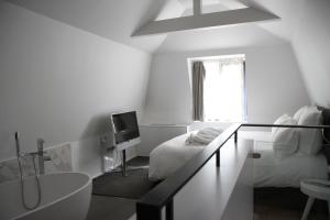 Letto o letti in una camera di Hôtel Quatorze
