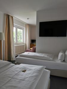 Postel nebo postele na pokoji v ubytování Hotel Schober