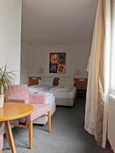 Postel nebo postele na pokoji v ubytování Hotel Schober