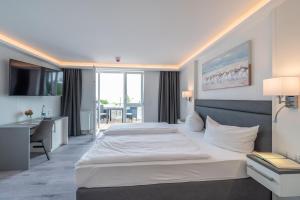 Postel nebo postele na pokoji v ubytování Hotel Königslinie