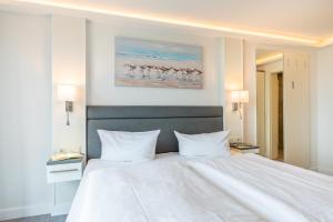 Postel nebo postele na pokoji v ubytování Hotel Königslinie