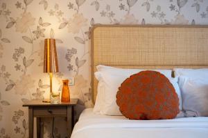 Giường trong phòng chung tại Villa Borgo Duino
