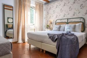 Giường trong phòng chung tại Villa Borgo Duino