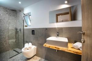 A bathroom at Vardakis house - 5 minutes from the famous Shipwreck Beach by Villa Mana Gers