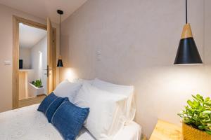 A bed or beds in a room at Vardakis house - 5 minutes from the famous Shipwreck Beach by Villa Mana Gers