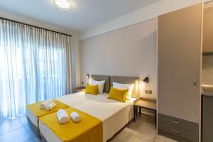 Postel nebo postele na pokoji v ubytování AURA APARTMENTS
