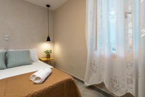 A bed or beds in a room at Vardakis house - 5 minutes from the famous Shipwreck Beach by Villa Mana Gers