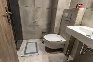 Koupelna v ubytování AURA APARTMENTS