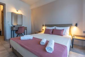 Postel nebo postele na pokoji v ubytování AURA APARTMENTS