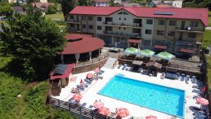 an aerial view of a hotel with a swimming pool at Ciuperca in Hunedoara