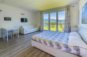 Postel nebo postele na pokoji v ubytování Direttamente Al Lago Apartments