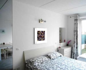 Postel nebo postele na pokoji v ubytování Direttamente Al Lago Apartments