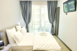 Postel nebo postele na pokoji v ubytování Sunset view Apartment- Spa Pools Resort + 33 fotografií