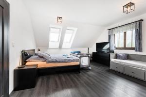 Postel nebo postele na pokoji v ubytování Apartmány Nová Salaš