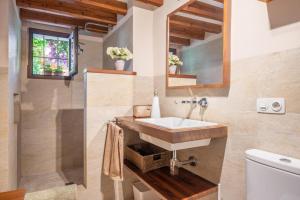 a bathroom with a sink and a toilet at Ca Sa Mar in Sóller +19 photos
