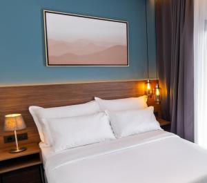 Postel nebo postele na pokoji v ubytování Boutique ROOMs 76