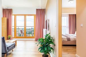 Posteľ alebo postele v izbe v ubytovaní Platan Tower Baltic & More Apartments