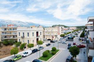 a city with cars parked on a street with buildings at Sparta View Apartments Nefelis Boutique Γ2 in Sparti