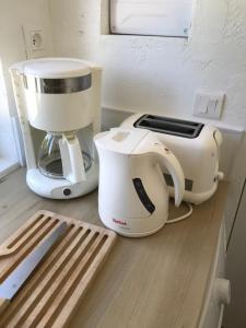 a white mixer sitting on top of a counter at La Ferme des Cailletiers chez Marco in Lucéram