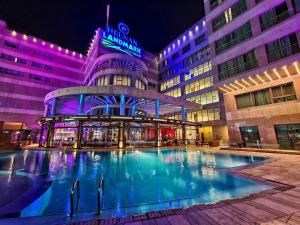 a large swimming pool in front of a building at Helnan Landmark Hotel in Cairo
