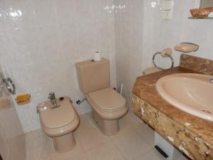 a bathroom with a toilet and a sink at Gaia in Torredembarra