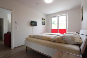 Ένα ή περισσότερα κρεβάτια σε δωμάτιο στο Am Ring 36 Whg 3 Otto