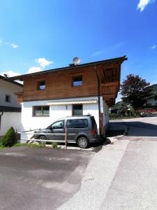 a car parked in front of a building at Ferienhaus ANDREA in Ramsau im Zillertal