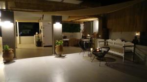 a living room with two chairs and a table at Malia Boutique Studios in Malia