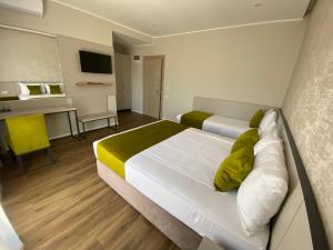 Cama o camas de una habitación en Hotel Rhodos