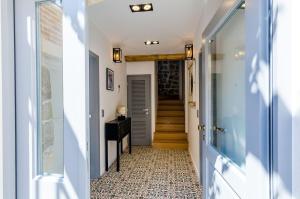 a hallway with a tile floor and a stairway at Villa Monte Santo in Dubrovnik