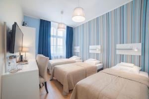Posteľ alebo postele v izbe v ubytovaní Hotel Traffic Wrocław Stare Miasto