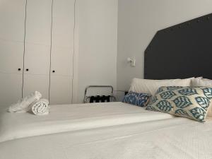 A bed or beds in a room at Hostal Hom Museo