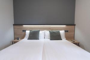 Posteľ alebo postele v izbe v ubytovaní Alda Centro Pamplona