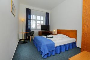 Ένα ή περισσότερα κρεβάτια σε δωμάτιο στο Hotel Magnolia