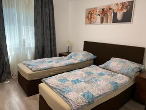 A bed or beds in a room at Apartament TT10 Botanicka
