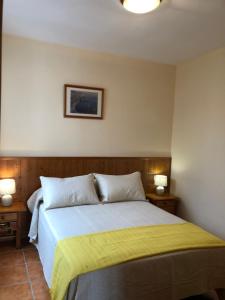 A bed or beds in a room at Apartamentos Cantarero Maro Nerja