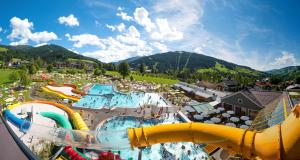 an aerial view of a water park in the mountains at Appartements Höller in Kleinarl