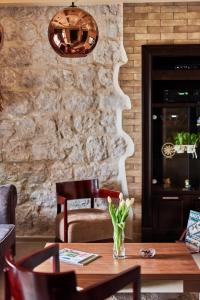 a dining room with a wooden table and chairs at Apartment Lav in the City Centre in Kotor