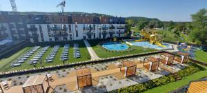 an aerial view of a resort with two pools at Apartament SenGA in Międzyzdroje