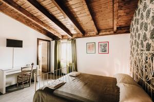 Postel nebo postele na pokoji v ubytování B&b La Cicala