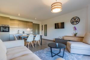 a living room with a couch and a table at Villa Orhideja in Cres