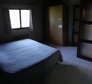 Uma cama ou camas num quarto em Apart Hotel y Cabañas Olivos del Sol