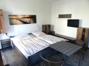 TV a/nebo společenská místnost v ubytování Eventhotel Ö - Cappuccino