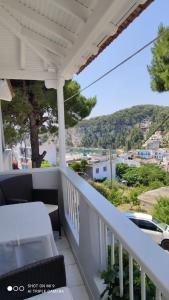 a balcony with a table and a view at Iason studio 1 in Patitiri